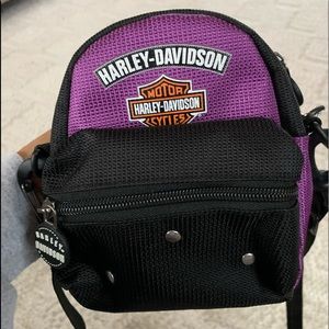This is a black and purple mini Harley Davison bag